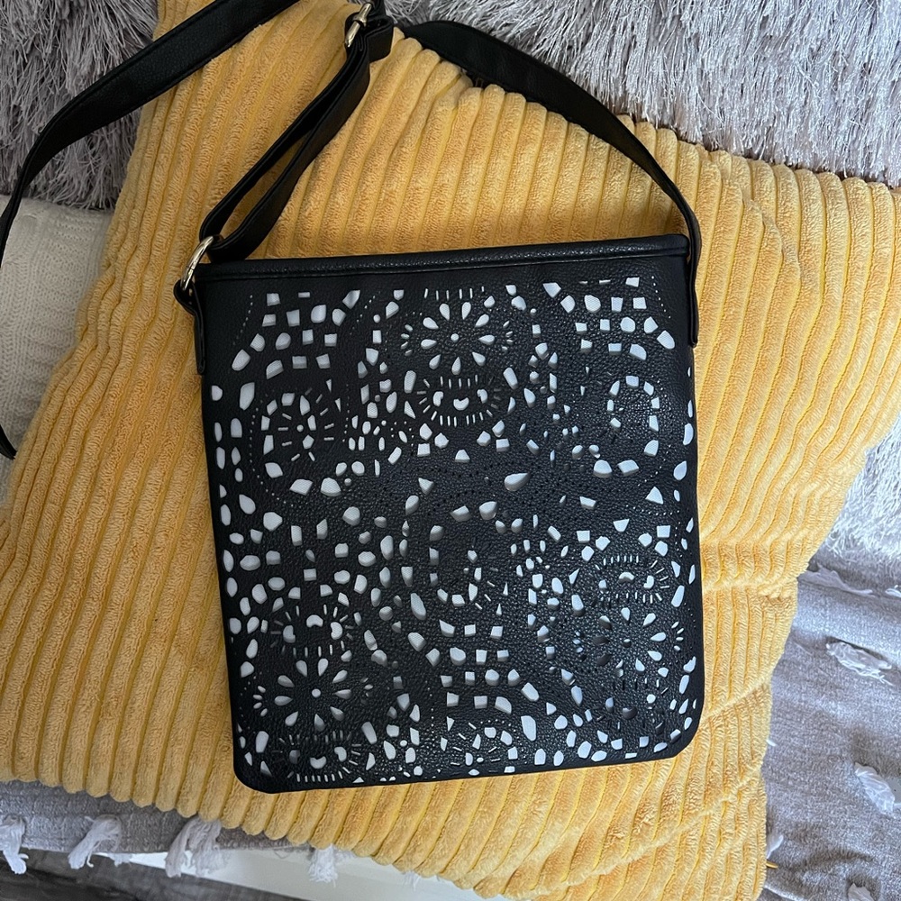 Stylish laser cut black faux leather crossbody! New!